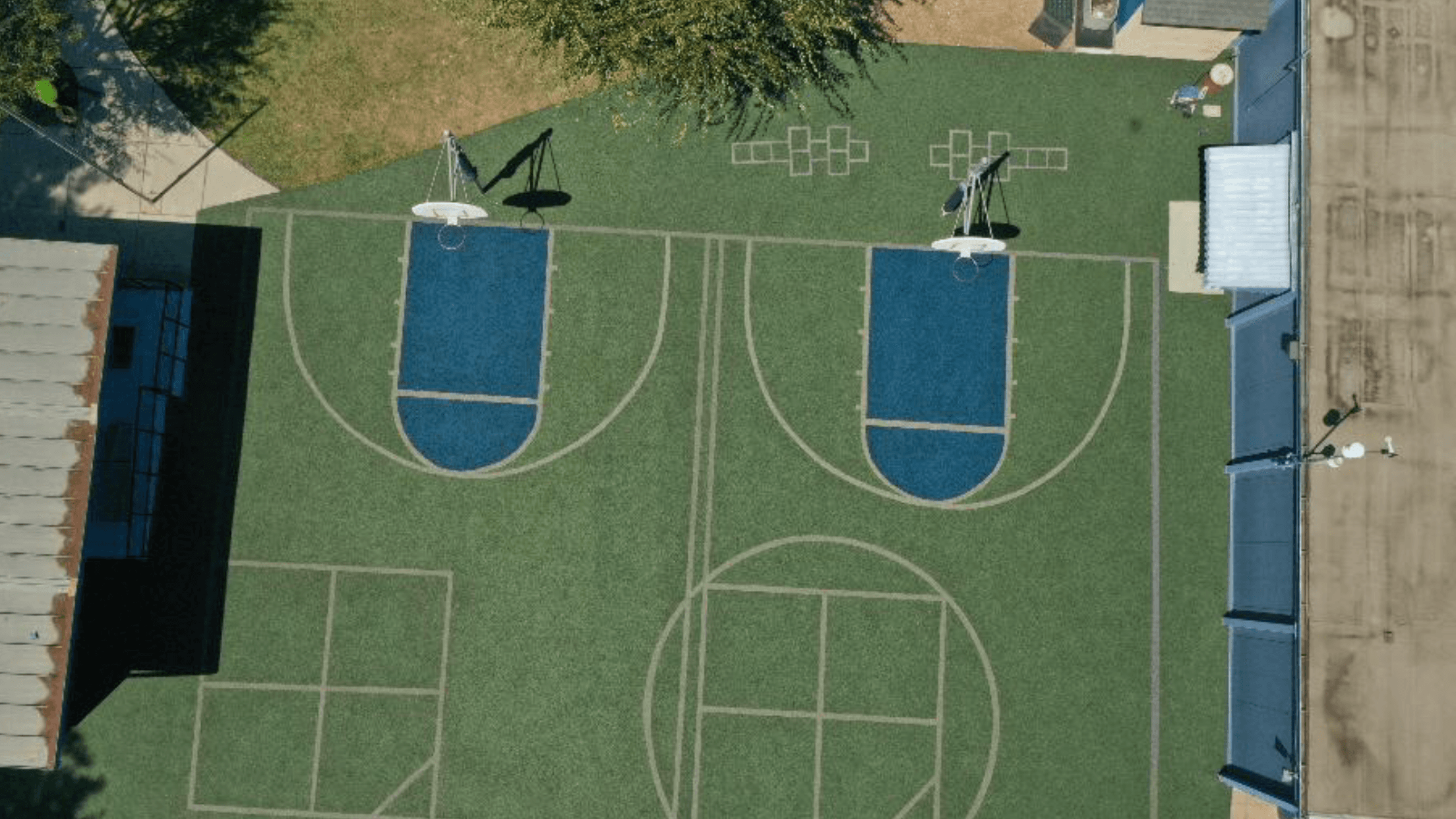 A basketball court with synthetic turf